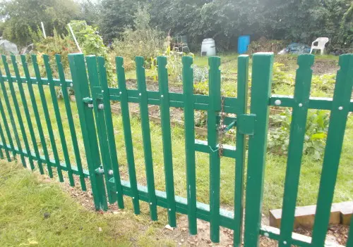Green palisade fence
